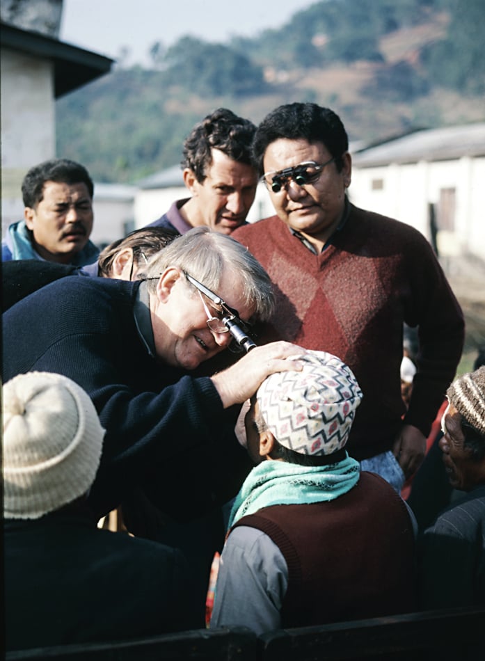  Professor Fred Hollows examines patient while Dr Sanduk Ruit watches on