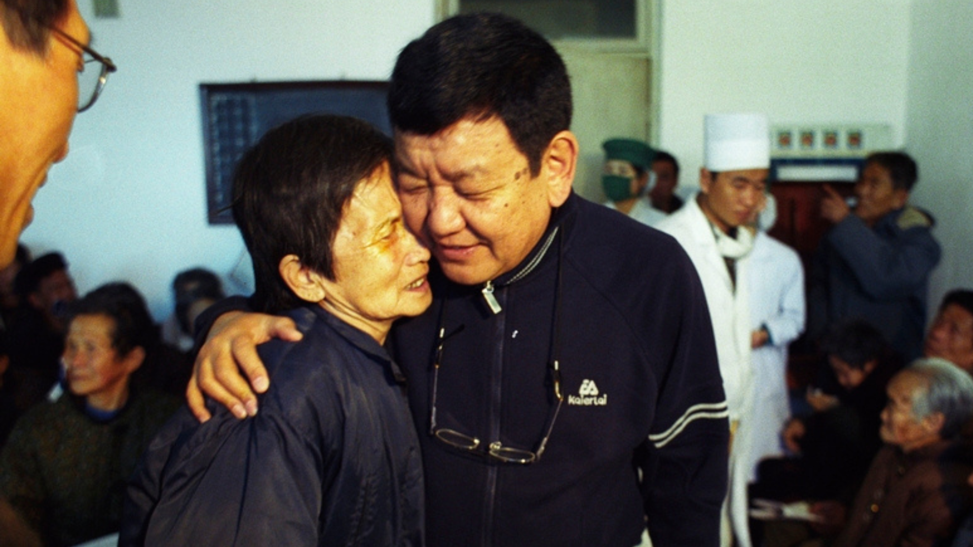 Dr Ruit hugging a patient in North Korea in 2005