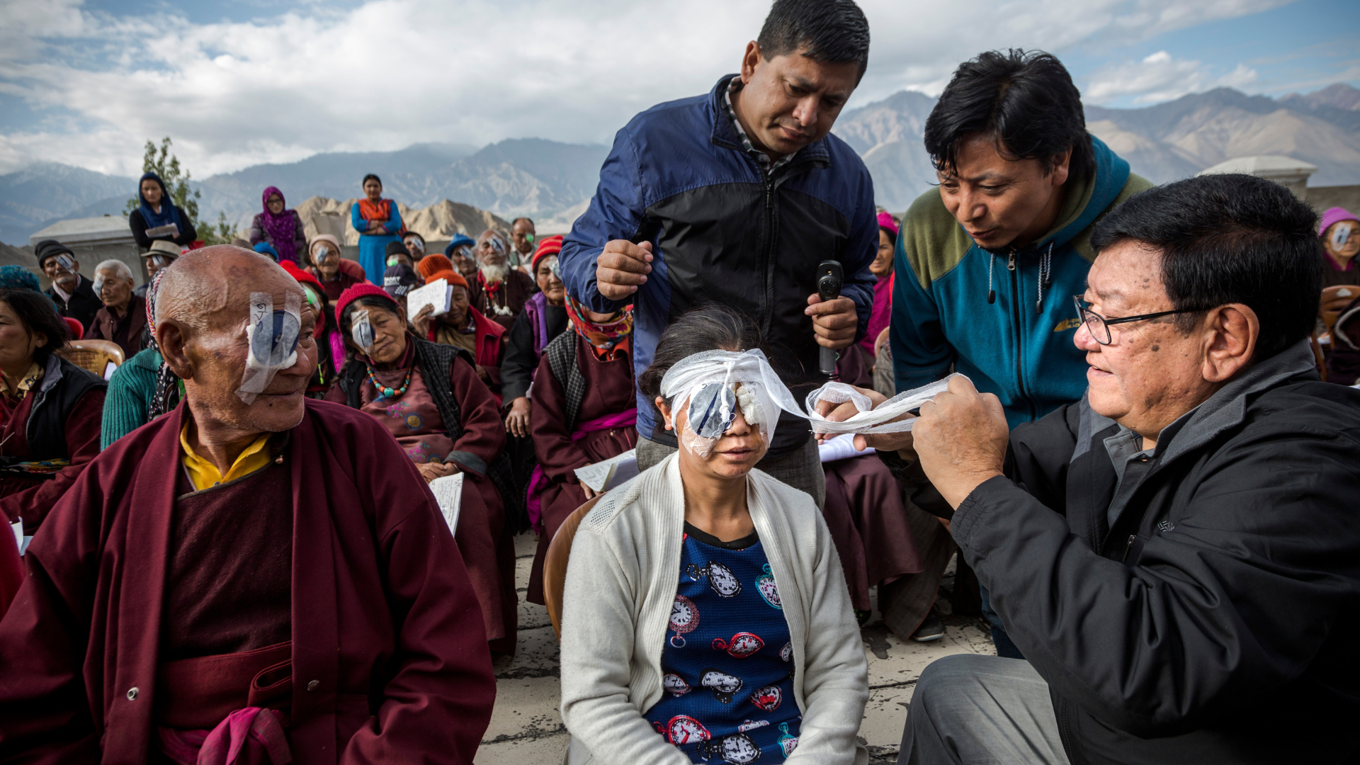 Dr Sanduk Ruit with patients from an eye camp in Ladakh