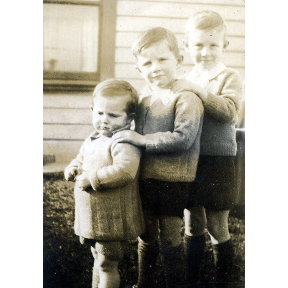 Fred standing in line with his brothers as a young boy