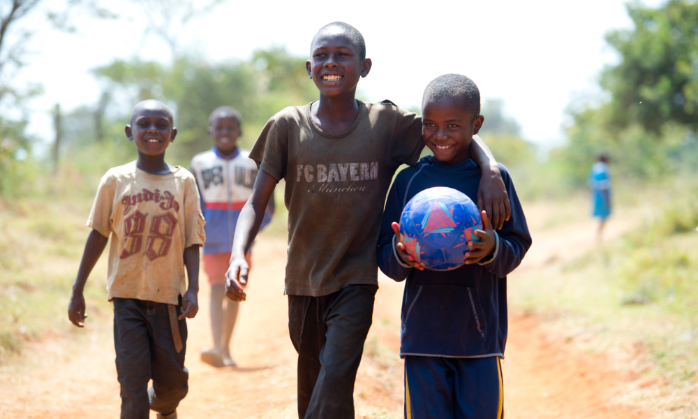 Children playing soccer in Kenya