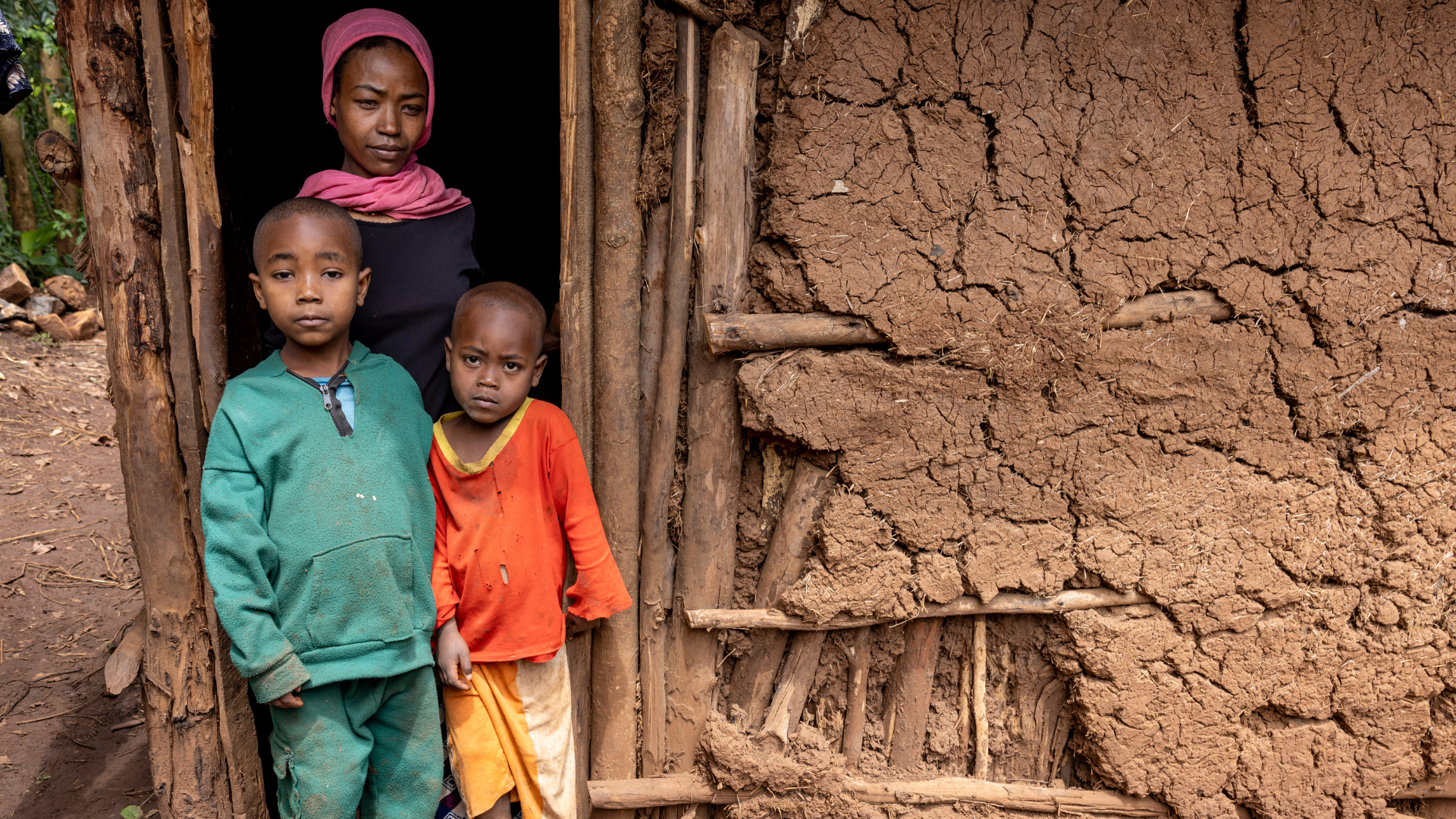 Semira at her home with her two young children