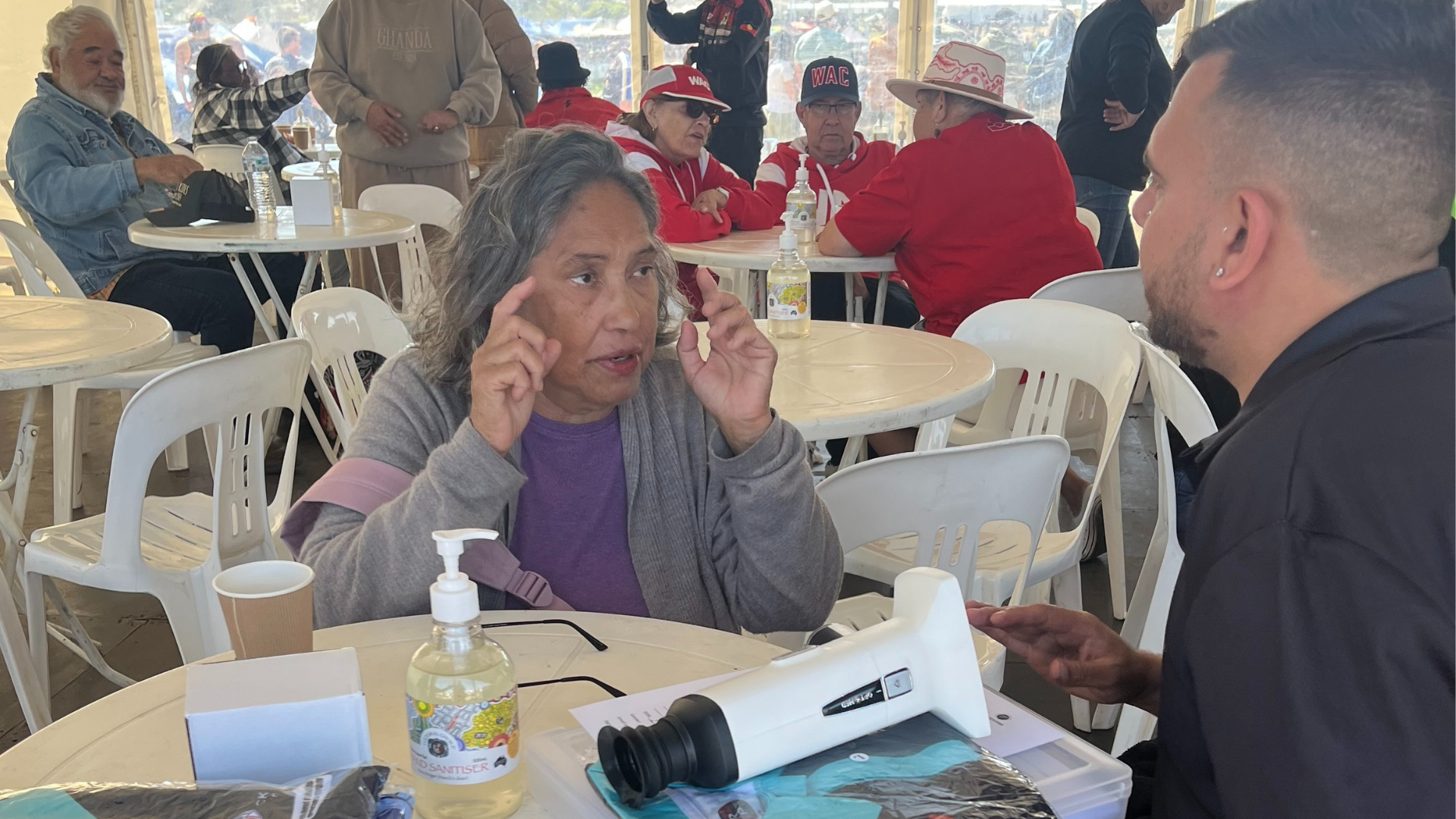 Eye health worker assessing the eyes of a participant of the Koori Knockout