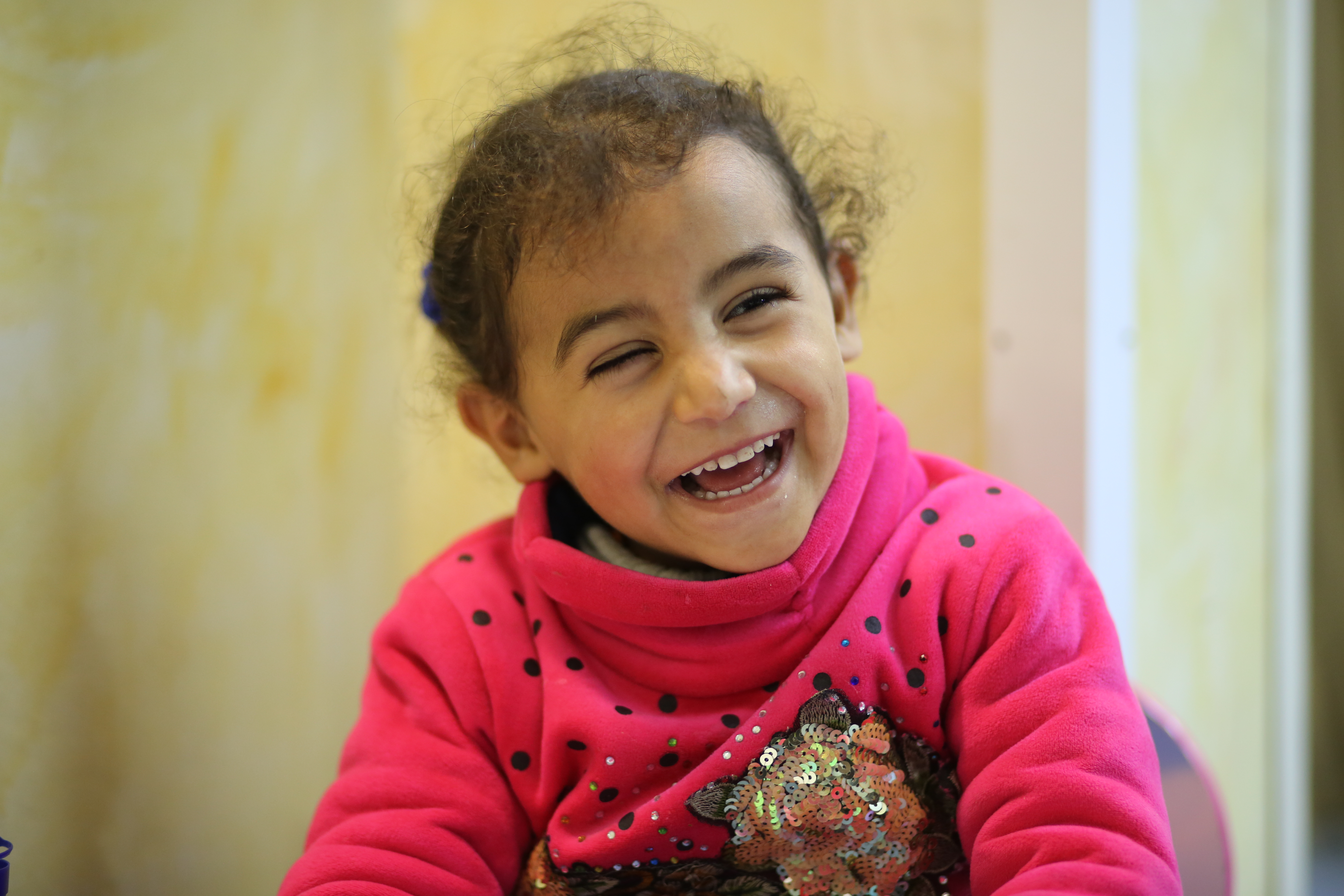 Three-year-old Jenin from Gaza smiles after her cataract surgery.