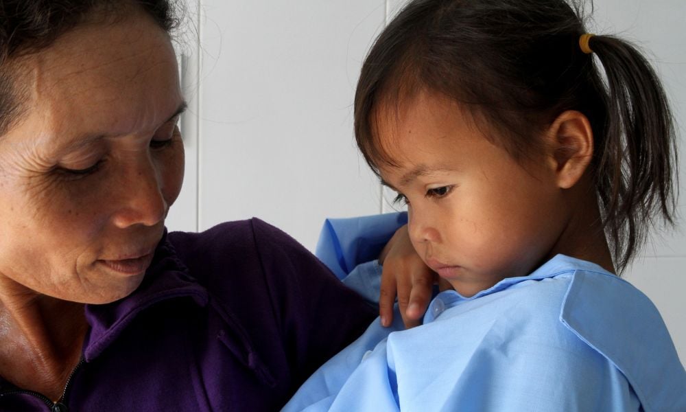 H'Nhi as a child with her mother