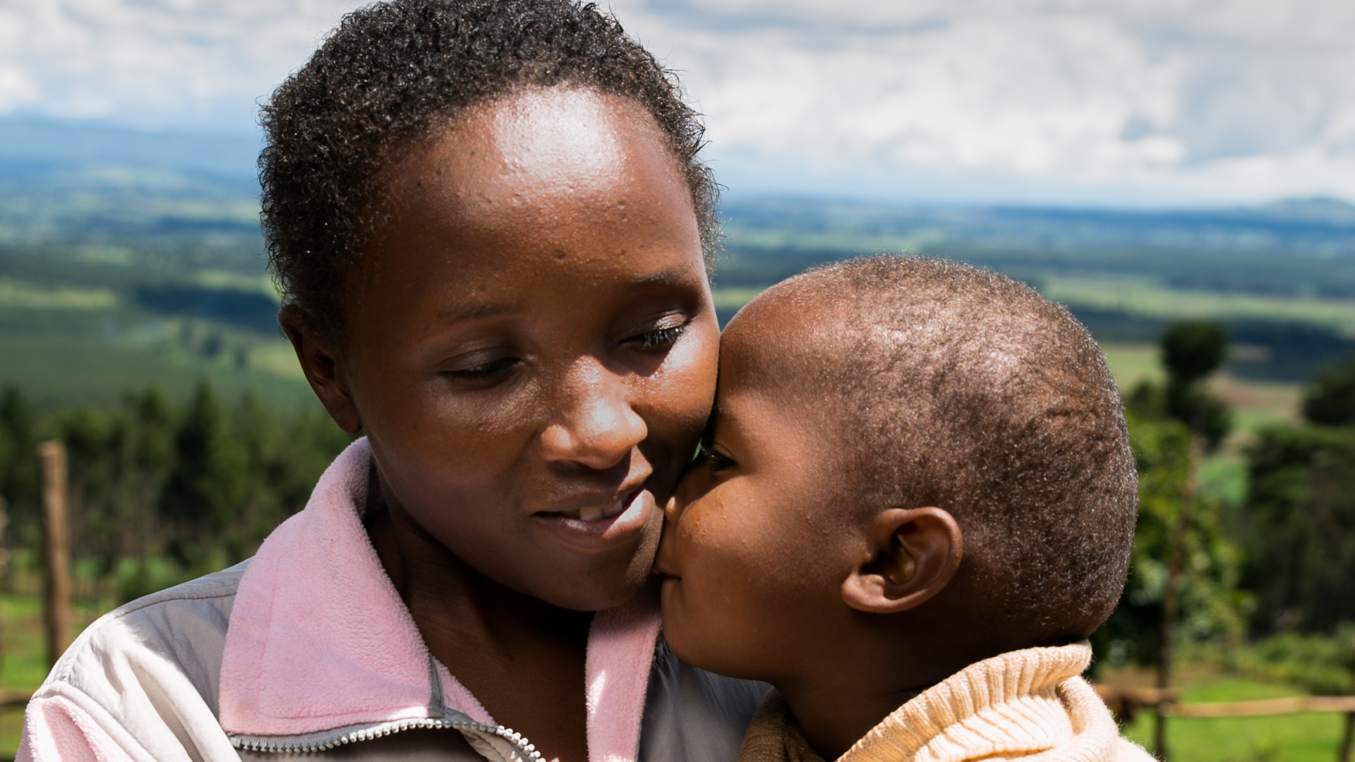 Monica from Kenya holding her son