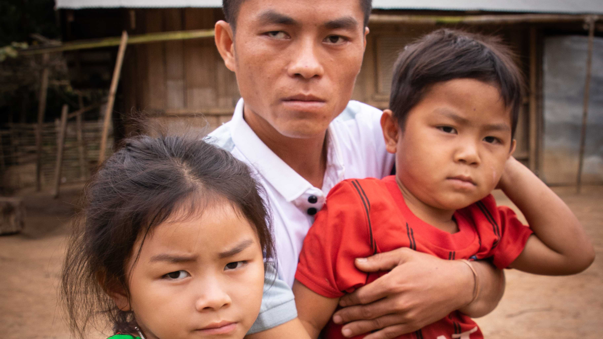 Porlee from Laos holding his two children