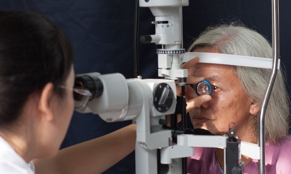 Vietnamese woman having an eye examination with partner of The Foundation, Alina Vision