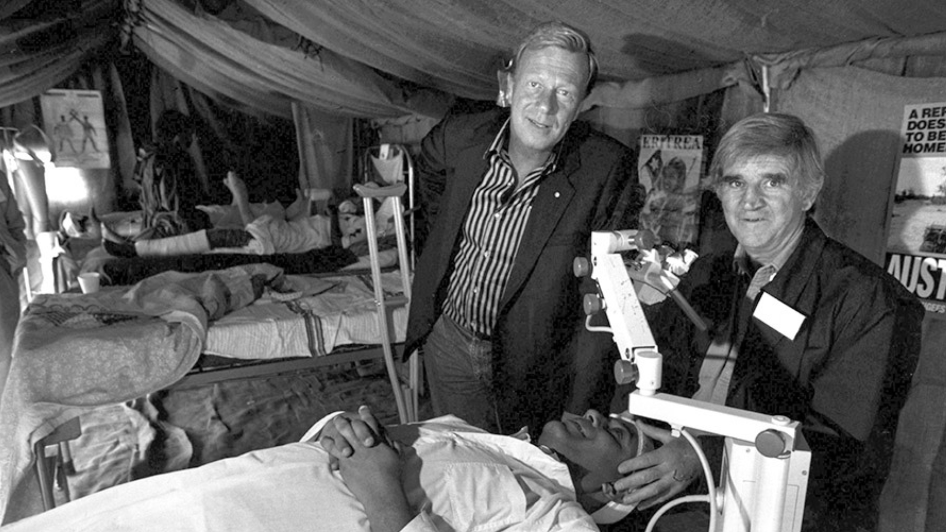 Fred Hollows showing Jack Thompson a mock surgery ward