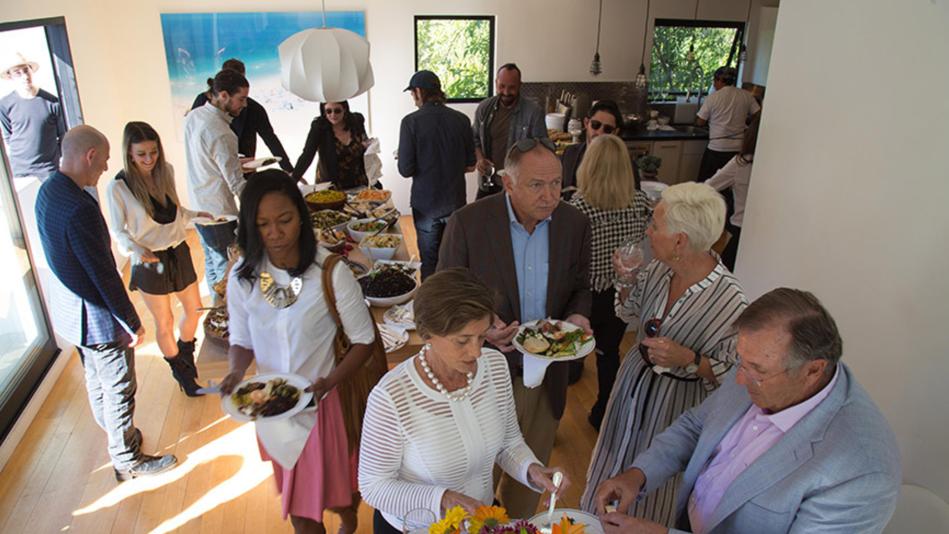 A birdseye view of people talking at Joel Edgerton's fundraising event in LA