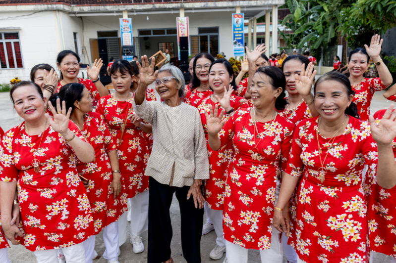 Den in Vietnam with her dancing group after having her site restored