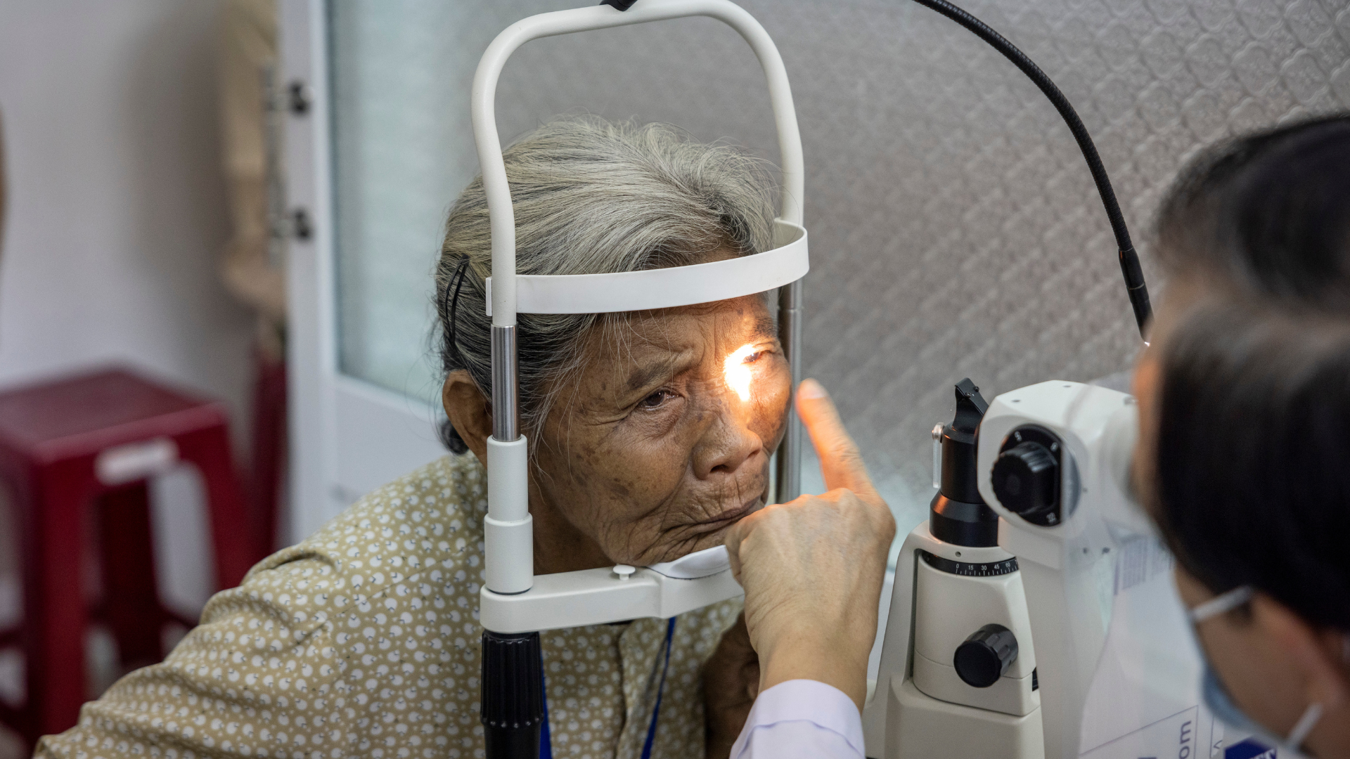 Den from Vietnam having her eyes examined