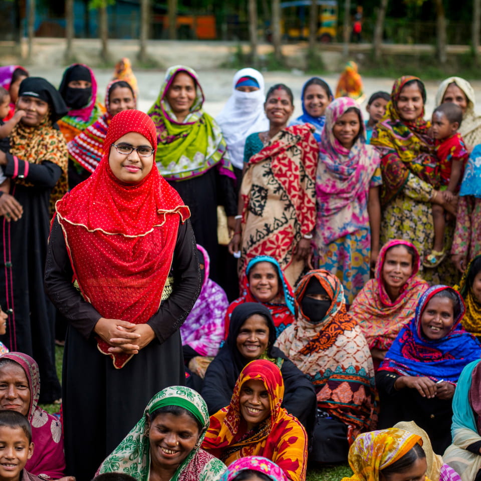 Health care worker standing in front of a group of women in Bangladesh