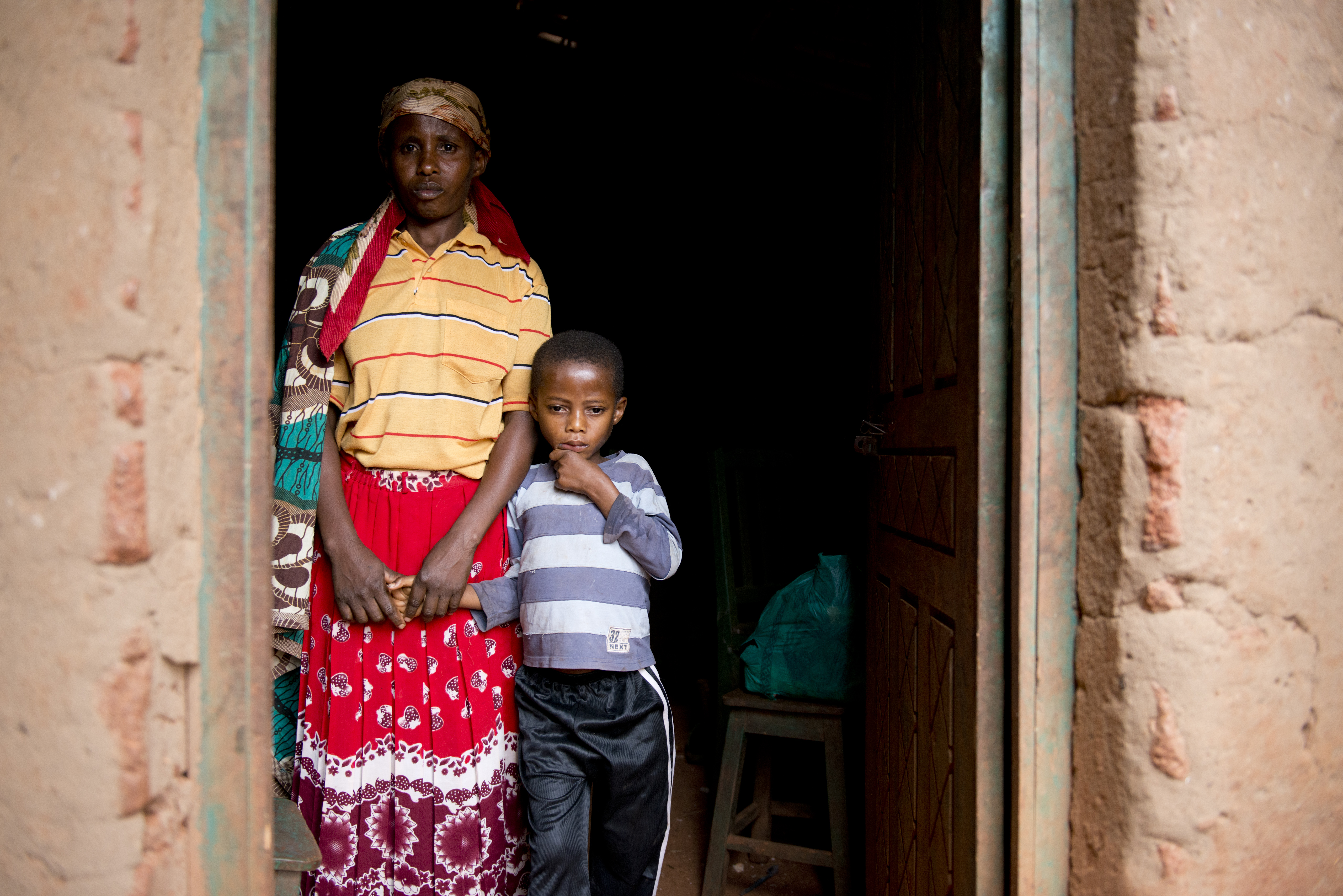 Leo with his mum at the door of their house