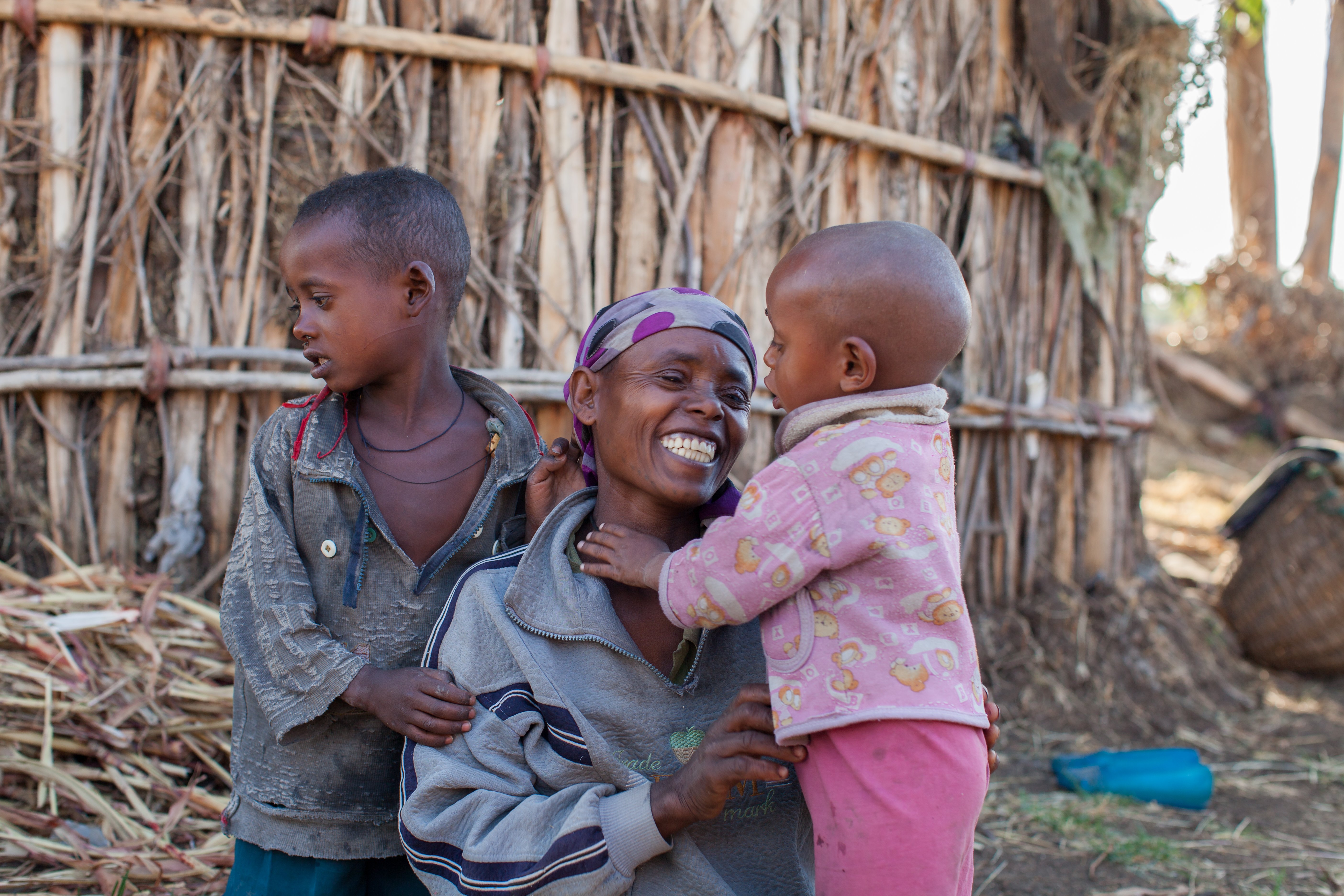 Shashetu smiling with her children after recovering from surgery