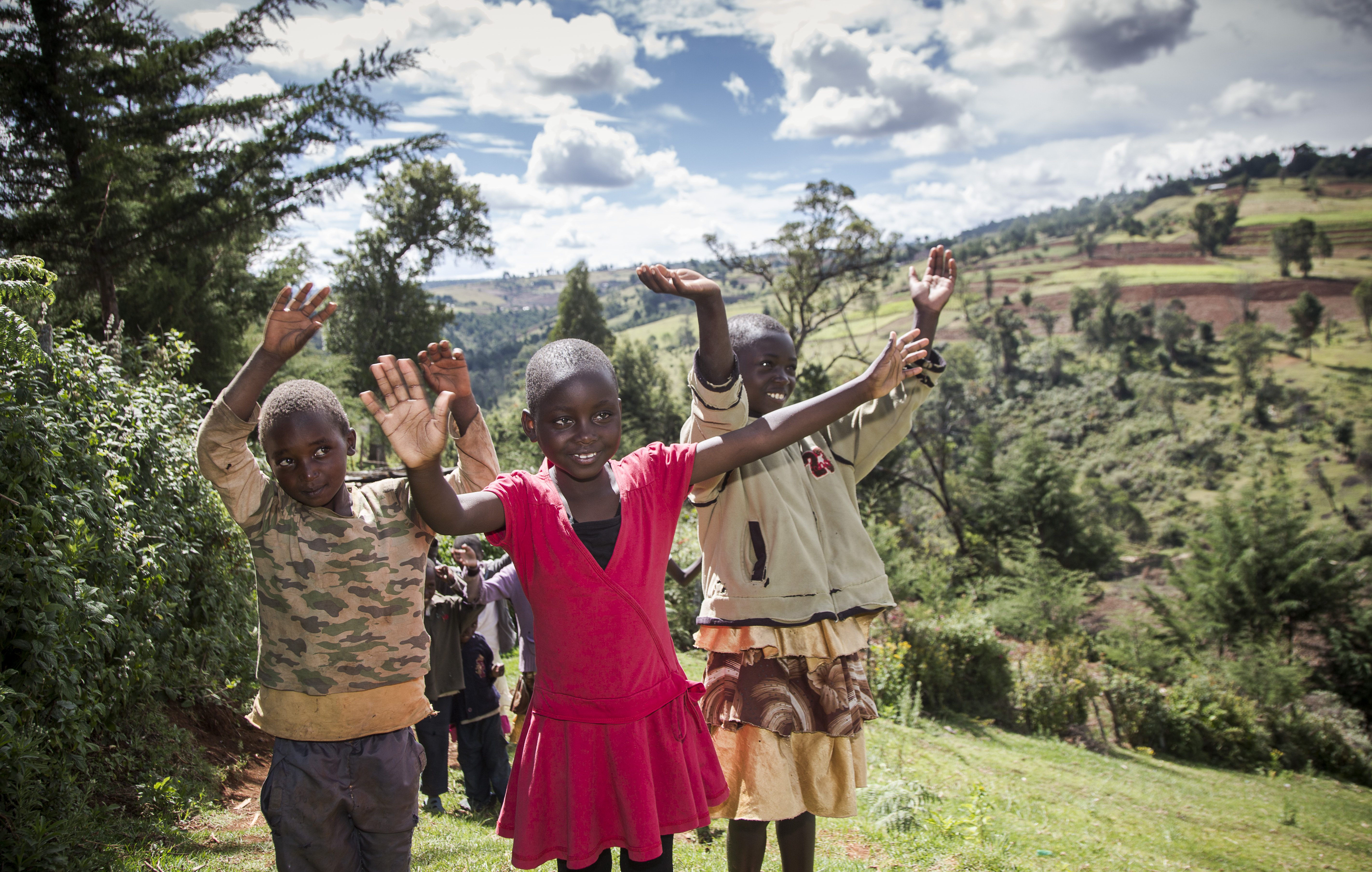 Nabiritha after surgery celebrating by dancing with her siblings and neighbours