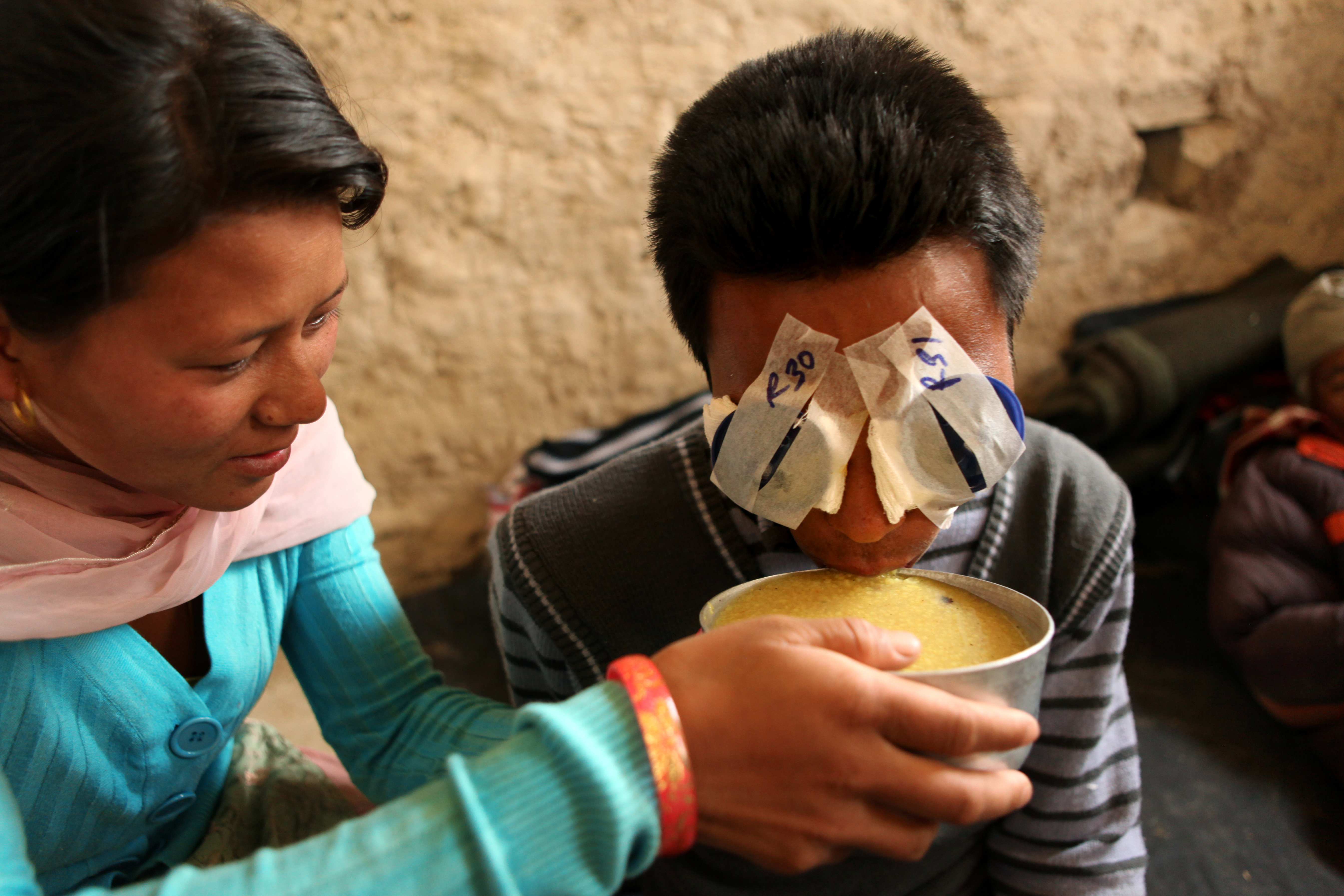 Kamala feeds Sudip soup while he waits for her patches to be removed from his eyes