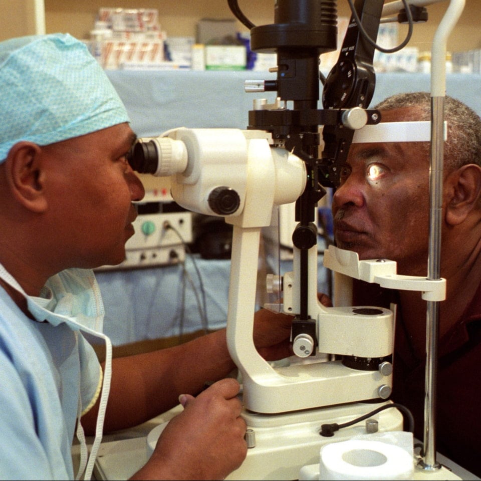 Doctor performing eye exam on patient